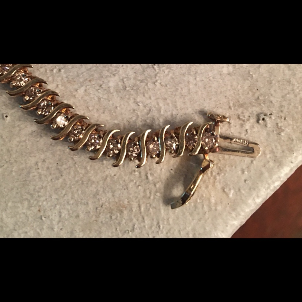 10 caret solid gold diamond bracelet.